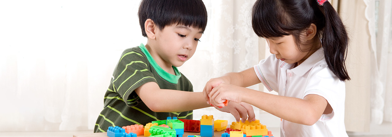 boy and girl playing with legos