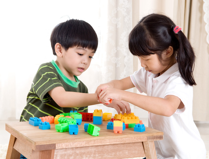 boy and girl playing with legos